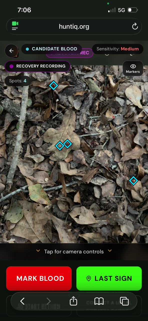 HuntIQ Blood Tracker displaying cyan diamond candidate markers over a natural-color woodland floor.